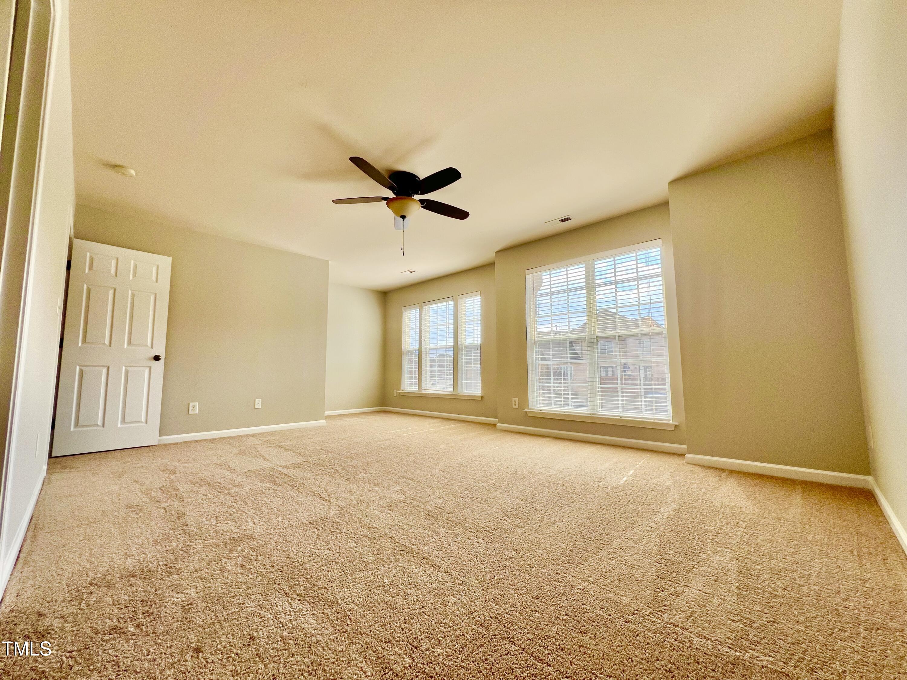 2118 Kedvale Avenue Raleigh, NC 27617 - Photo 9 of 17 a view of an empty room with a window