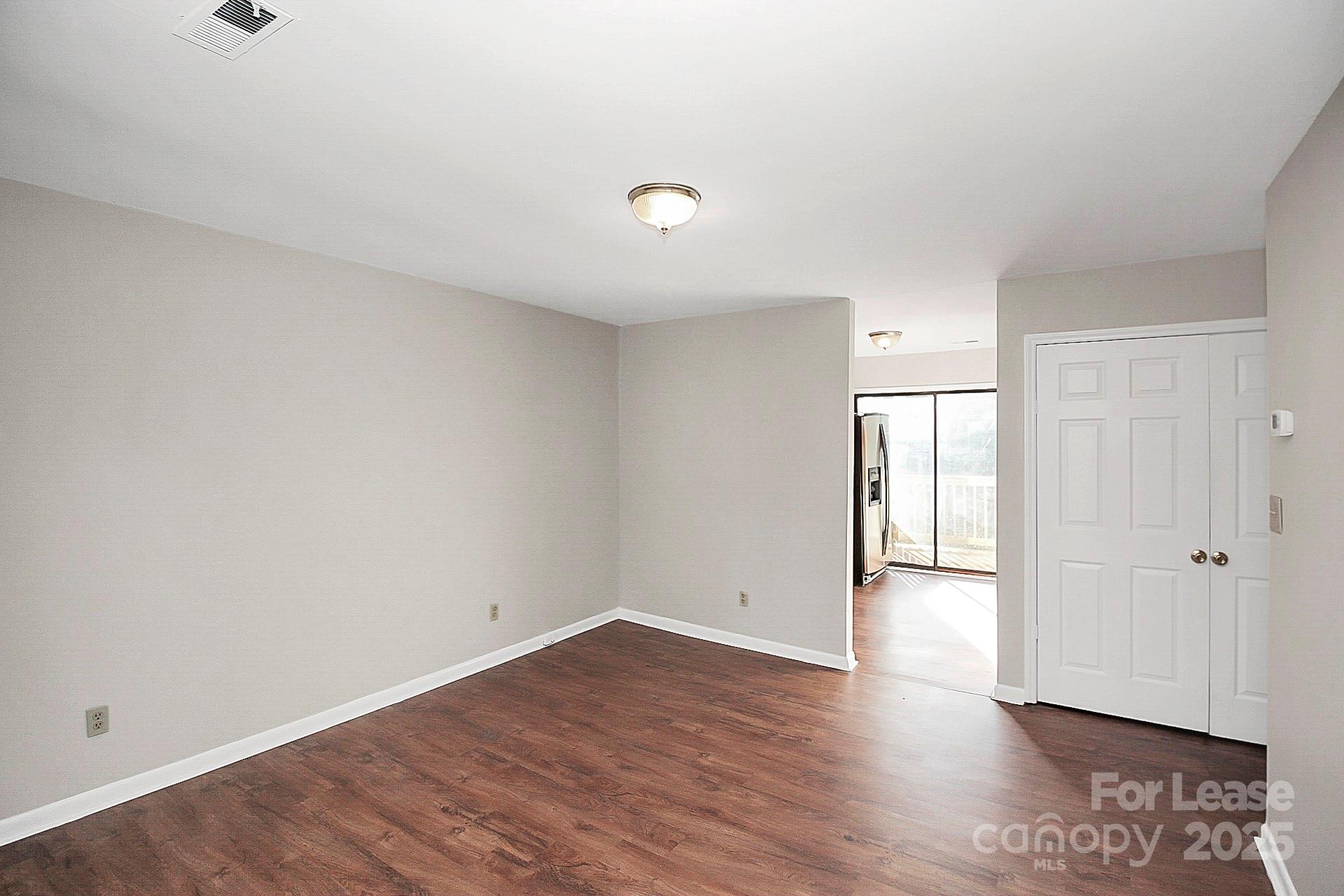501 North Ransom Street, Unit C Gastonia, NC 28052 - Photo 5 of 19 wooden floor in an empty room