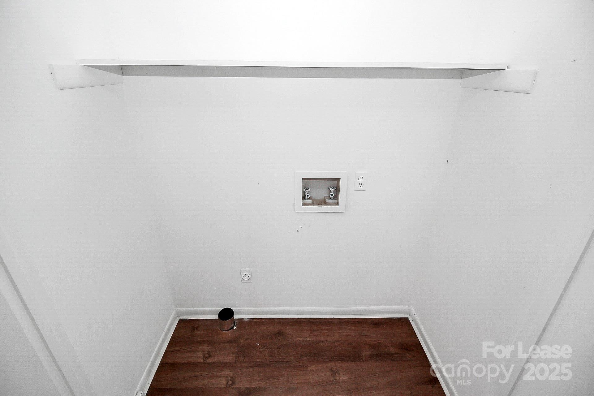 501 North Ransom Street, Unit C Gastonia, NC 28052 - Photo 9 of 19 a view of a room with wooden floor