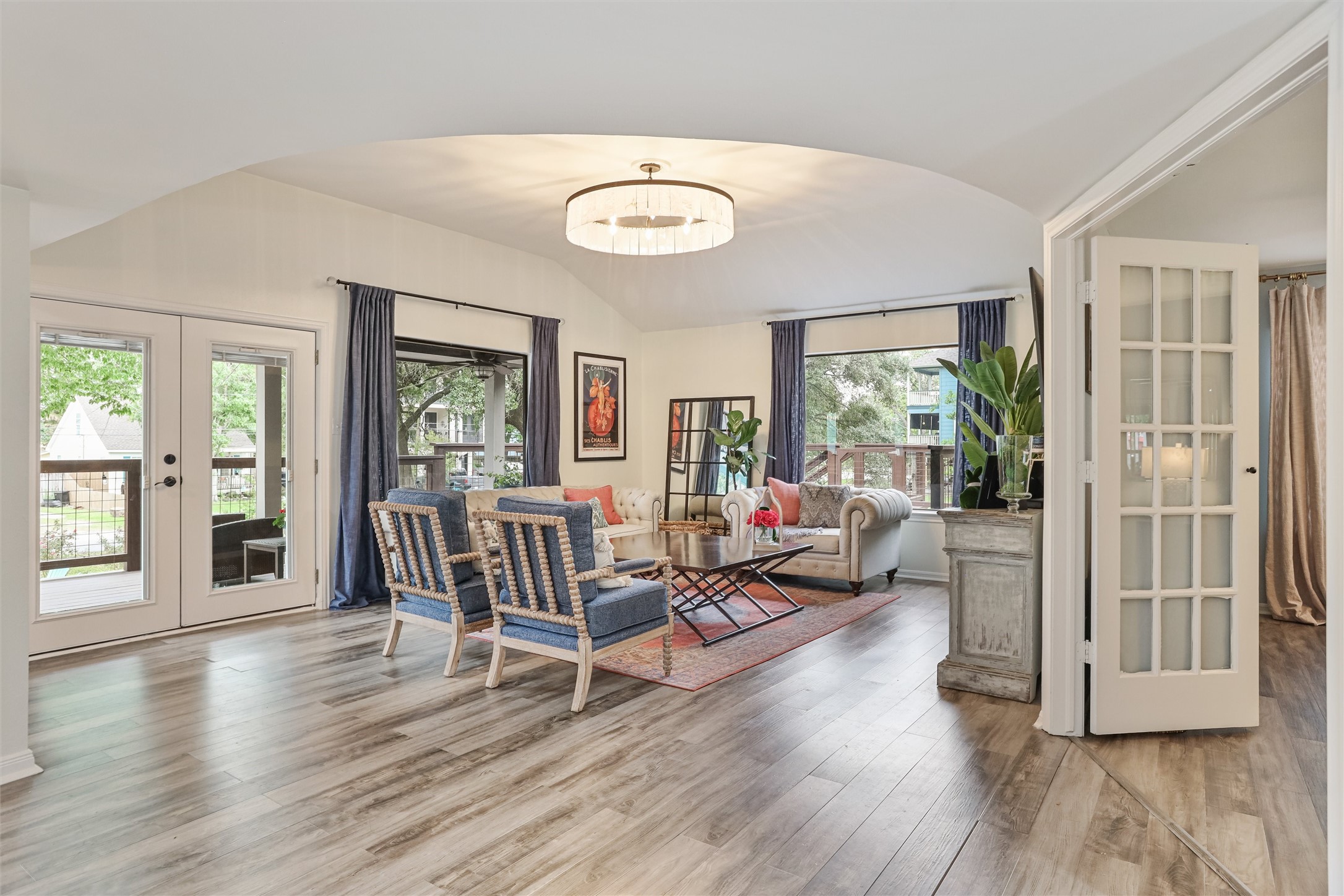 224 Clear Lake Road Clear Lake Shores, TX 77565 - Photo 19 of 50 Elegant living area with oversized windows allowing you to enjoy the spacious lot and lush landscaping