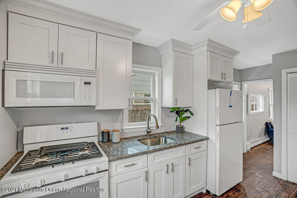140 Pinehurst Road Brick, NJ 08723 - Photo 12 of 13 a kitchen with granite countertop a refrigerator and a sink