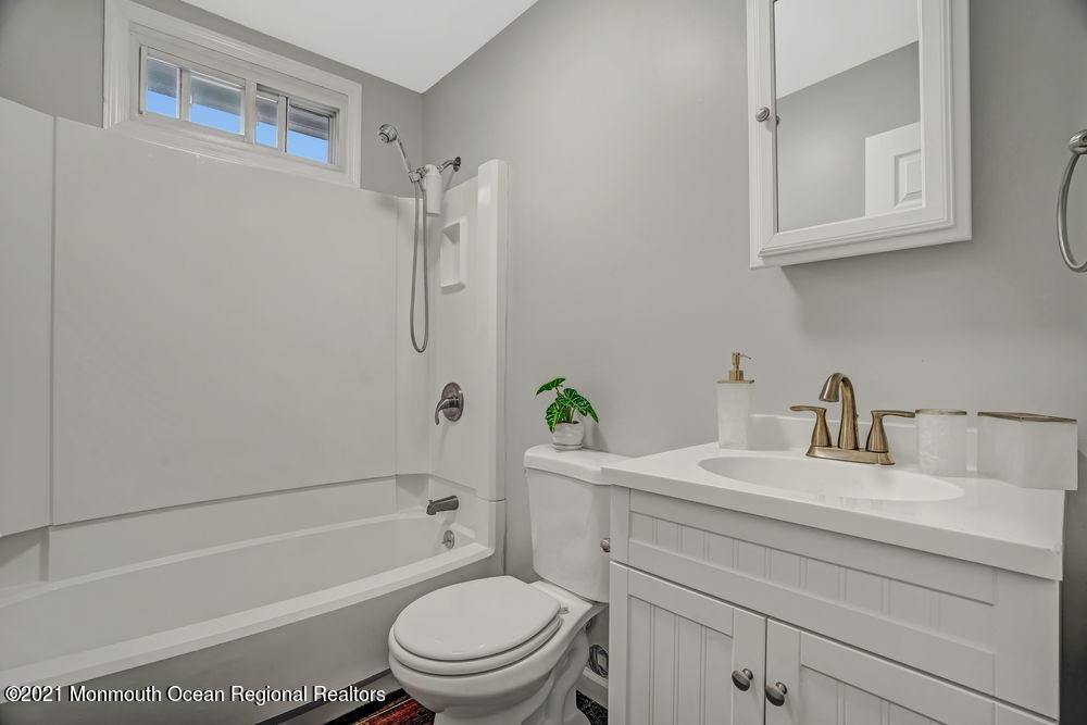 140 Pinehurst Road Brick, NJ 08723 - Photo 8 of 13 a bathroom with a sink toilet a bathtub and shower