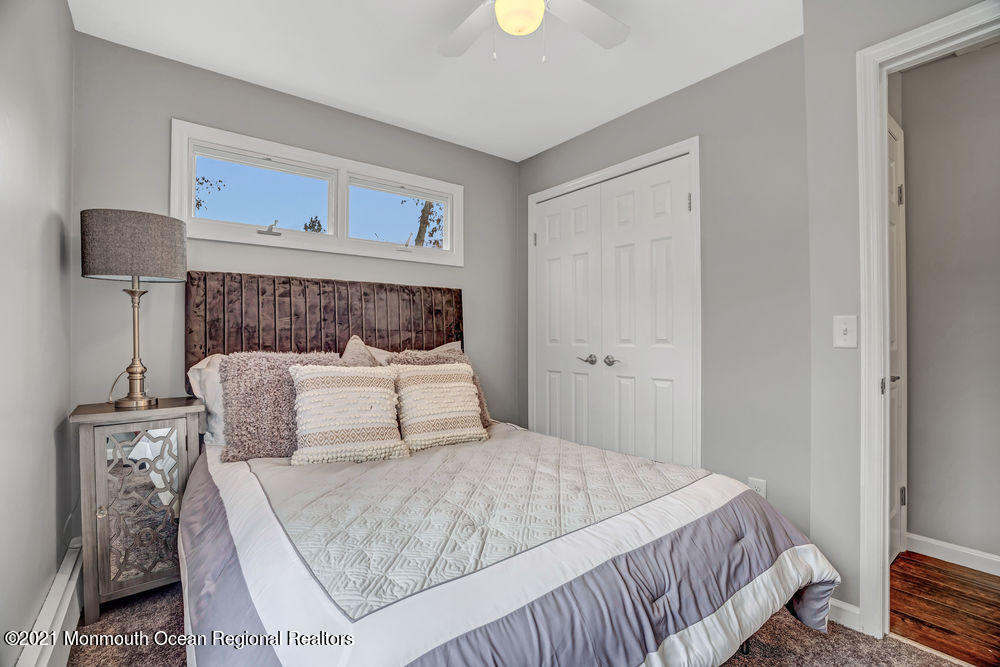 140 Pinehurst Road Brick, NJ 08723 - Photo 10 of 13 a bedroom with a bed and window