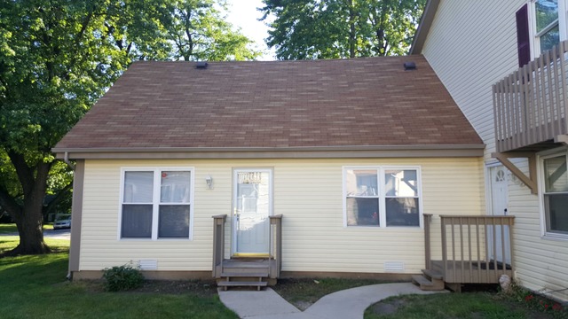 238 Chippewa Court, Unit A Bolingbrook, IL 60440 - Photo 1 of 8 a side view of small house with yard