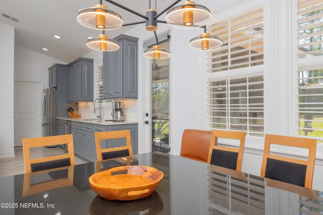 a view of a house with backyard porch and sitting area