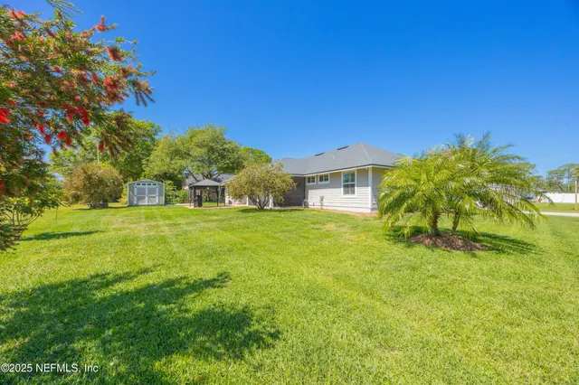 a bathroom with a granite countertop sink and a bathtub