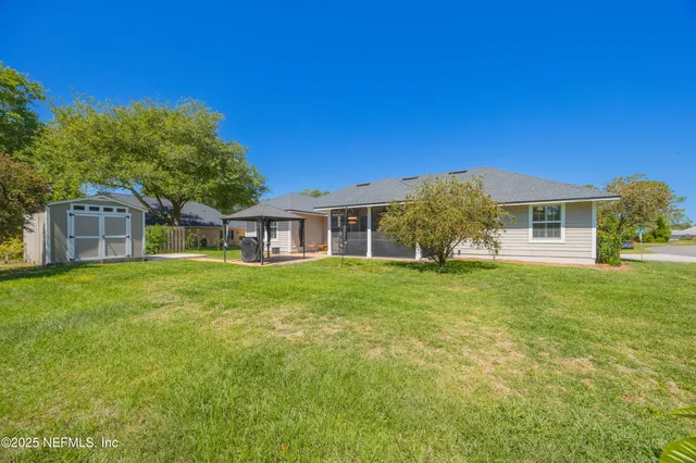 a bathroom with bathtub and window