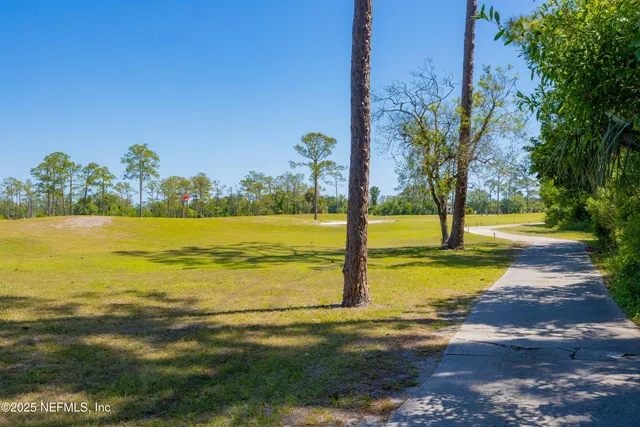 a bedroom with a bed and flat screen tv