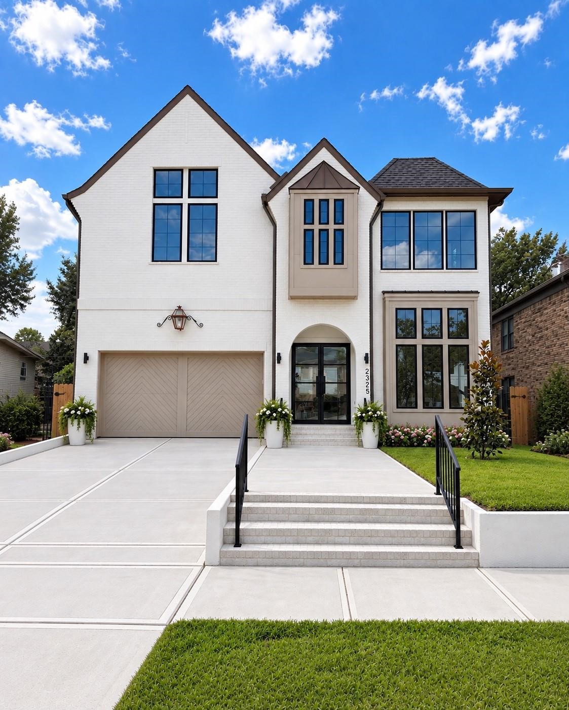 2325 Wroxton Road Houston, TX 77005 - Photo 1 of 34 Stunning Brick Exterior with brick lined grand entrance, Iron double door, custom garage door, gas lamp, oversized driveway and retaining wall