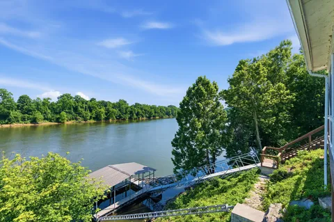 a view of a lake with a house in the background