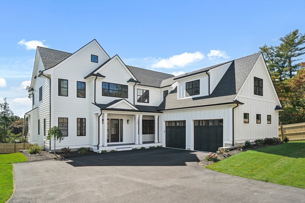 front view of a house with a yard
