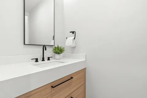 a bathroom with a sink and a mirror
