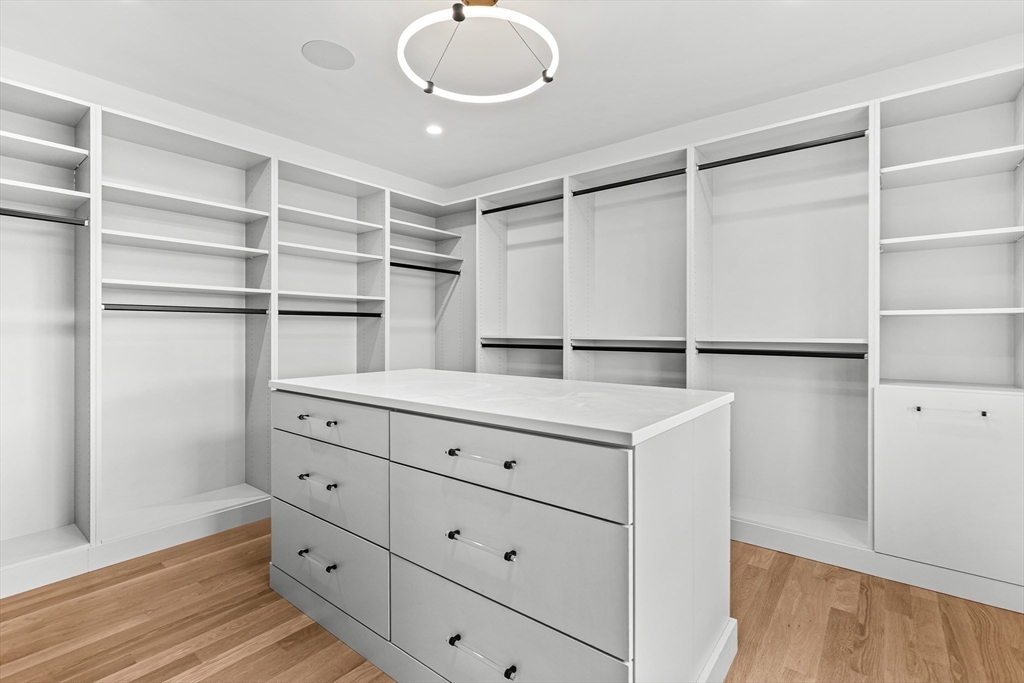 133 Lawton Road Needham, MA 02492 - Photo 21 of 36 a kitchen with a refrigerator and cabinets