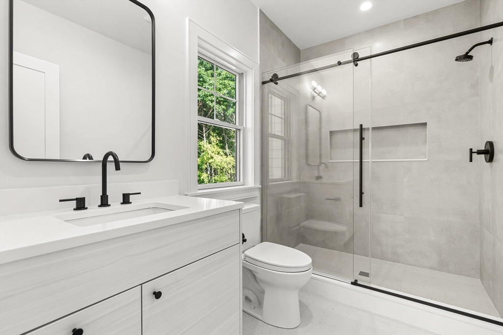 133 Lawton Road Needham, MA 02492 - Photo 23 of 36 a bathroom with a sink toilet and shower