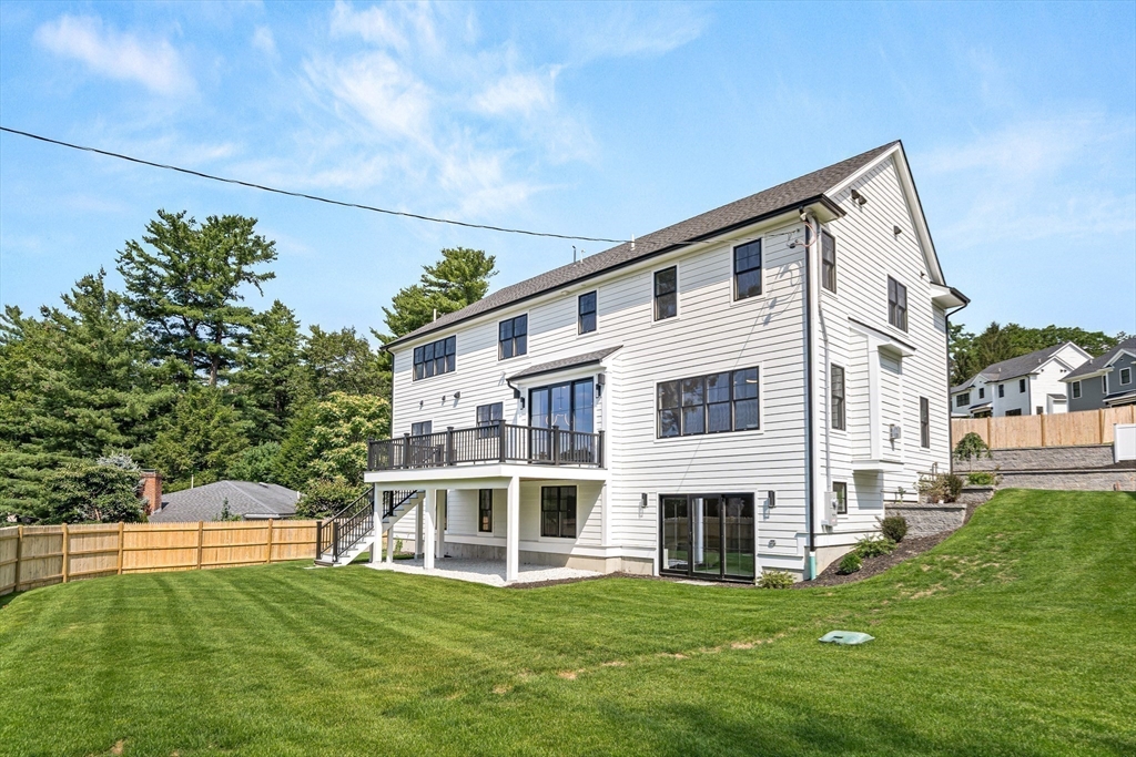 133 Lawton Road Needham, MA 02492 - Photo 36 of 36 a front view of a house with a garden