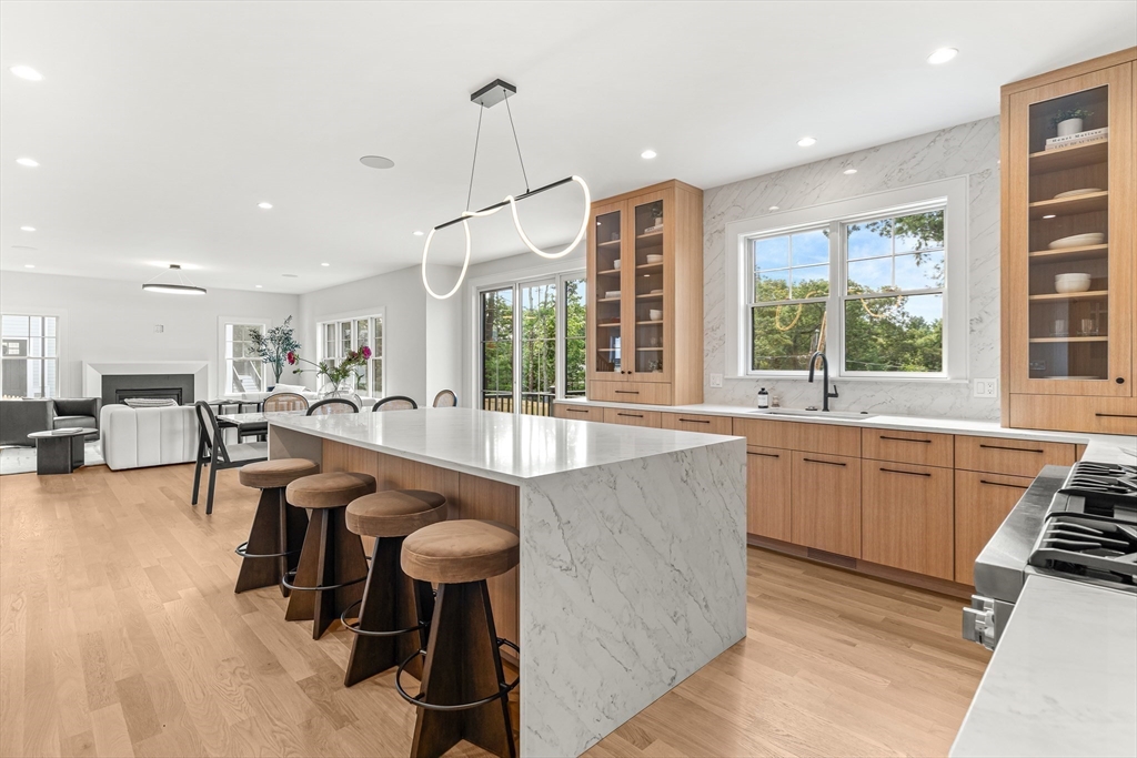 133 Lawton Road Needham, MA 02492 - Photo 7 of 36 a kitchen with sink table and chairs
