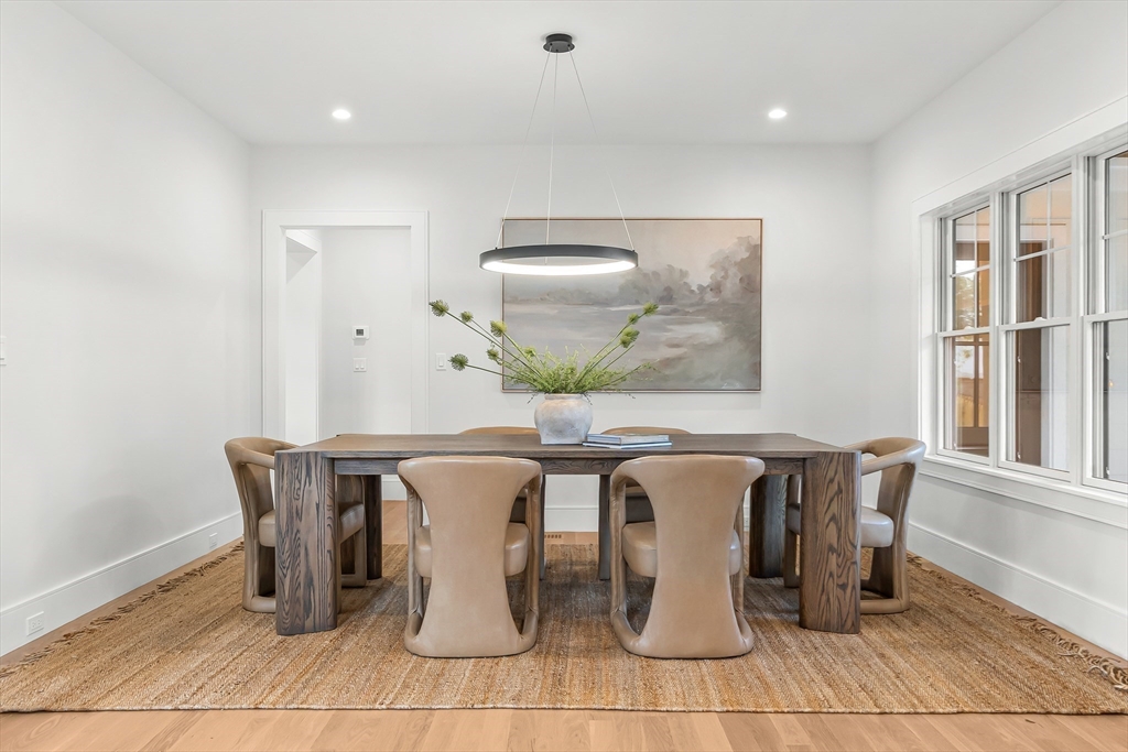 133 Lawton Road Needham, MA 02492 - Photo 9 of 36 a dining room with chairs and view of kitchen