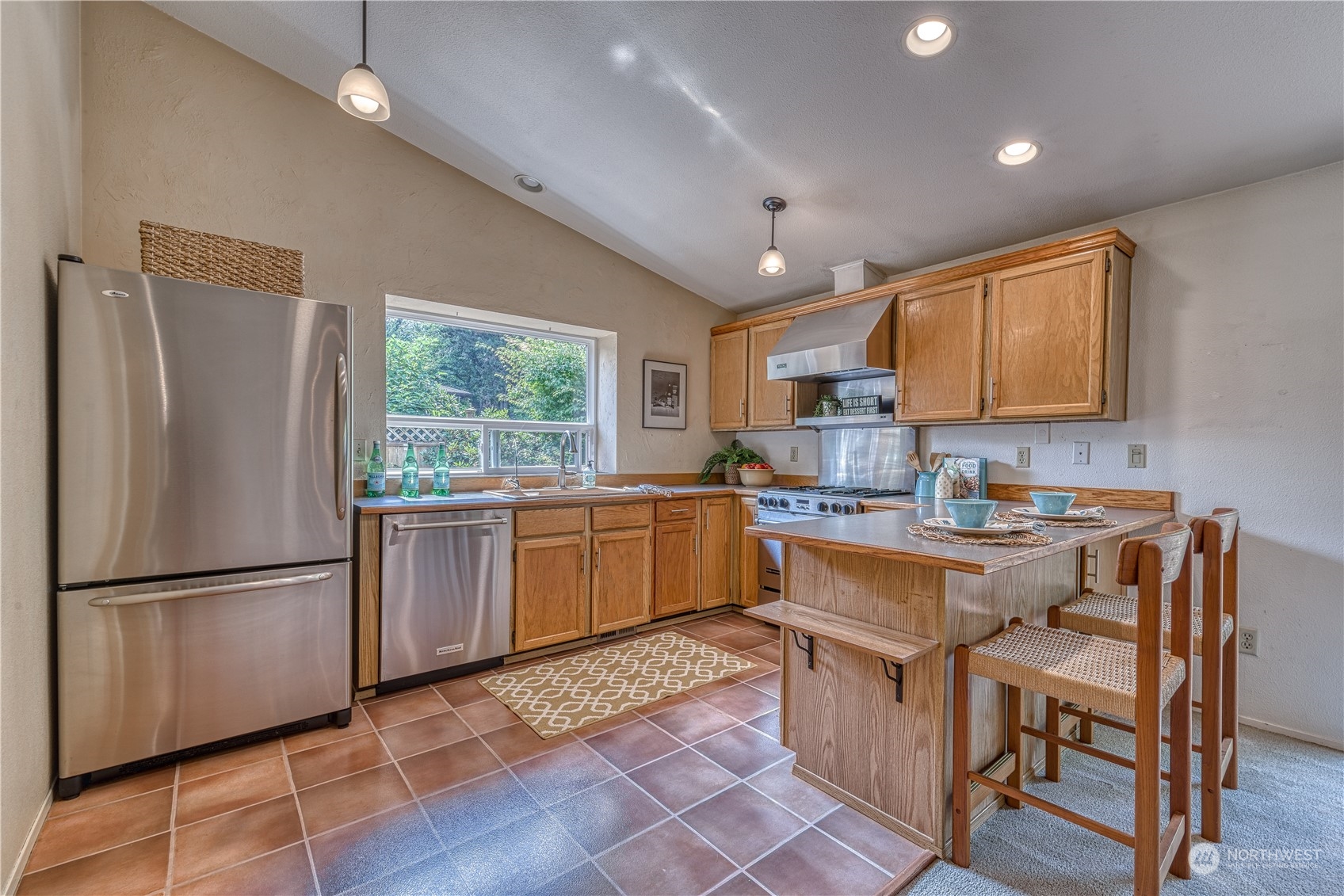 7720 Insel Avenue Gig Harbor, WA 98335 - Photo 11 of 29 a kitchen with sink cabinets and window