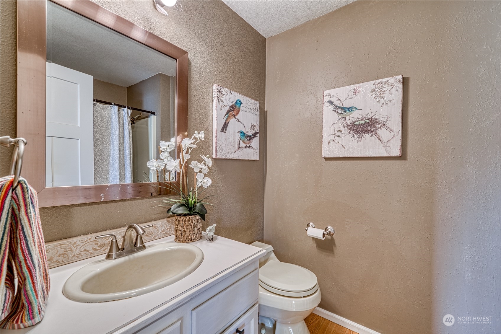 7720 Insel Avenue Gig Harbor, WA 98335 - Photo 14 of 29 a bathroom with a sink and a toilet