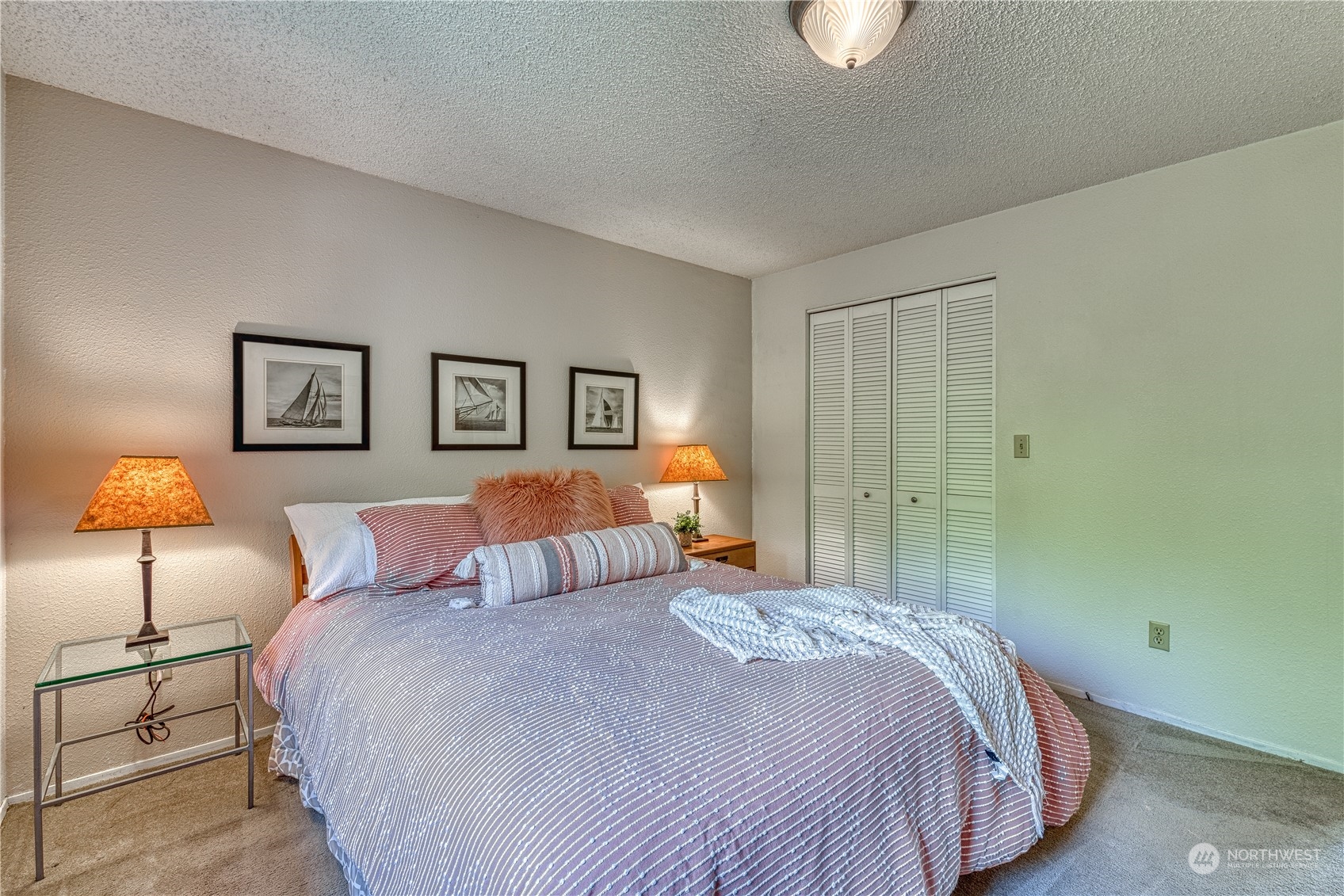 7720 Insel Avenue Gig Harbor, WA 98335 - Photo 20 of 29 a bedroom with a bed and a lamp