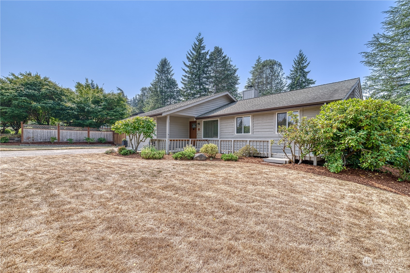 7720 Insel Avenue Gig Harbor, WA 98335 - Photo 2 of 29 a view of a house with a yard and potted plants