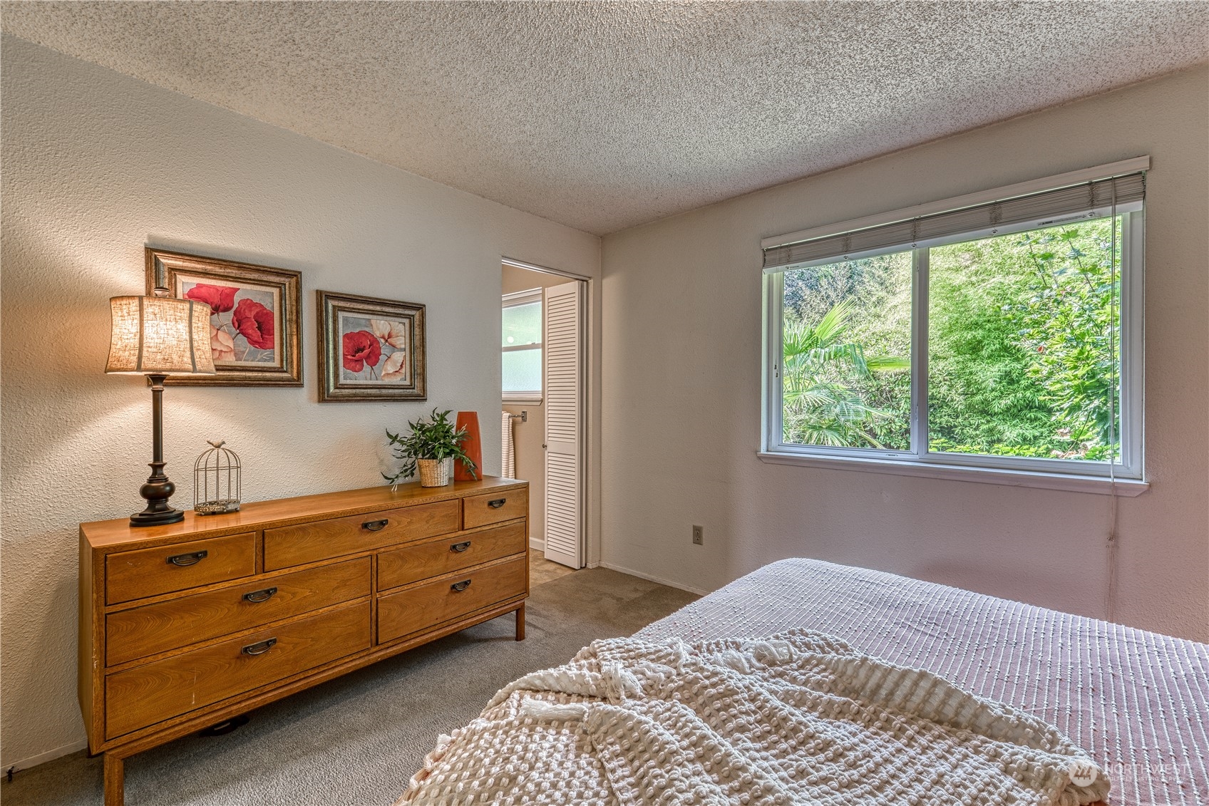 7720 Insel Avenue Gig Harbor, WA 98335 - Photo 21 of 29 a bedroom with a bed and a window