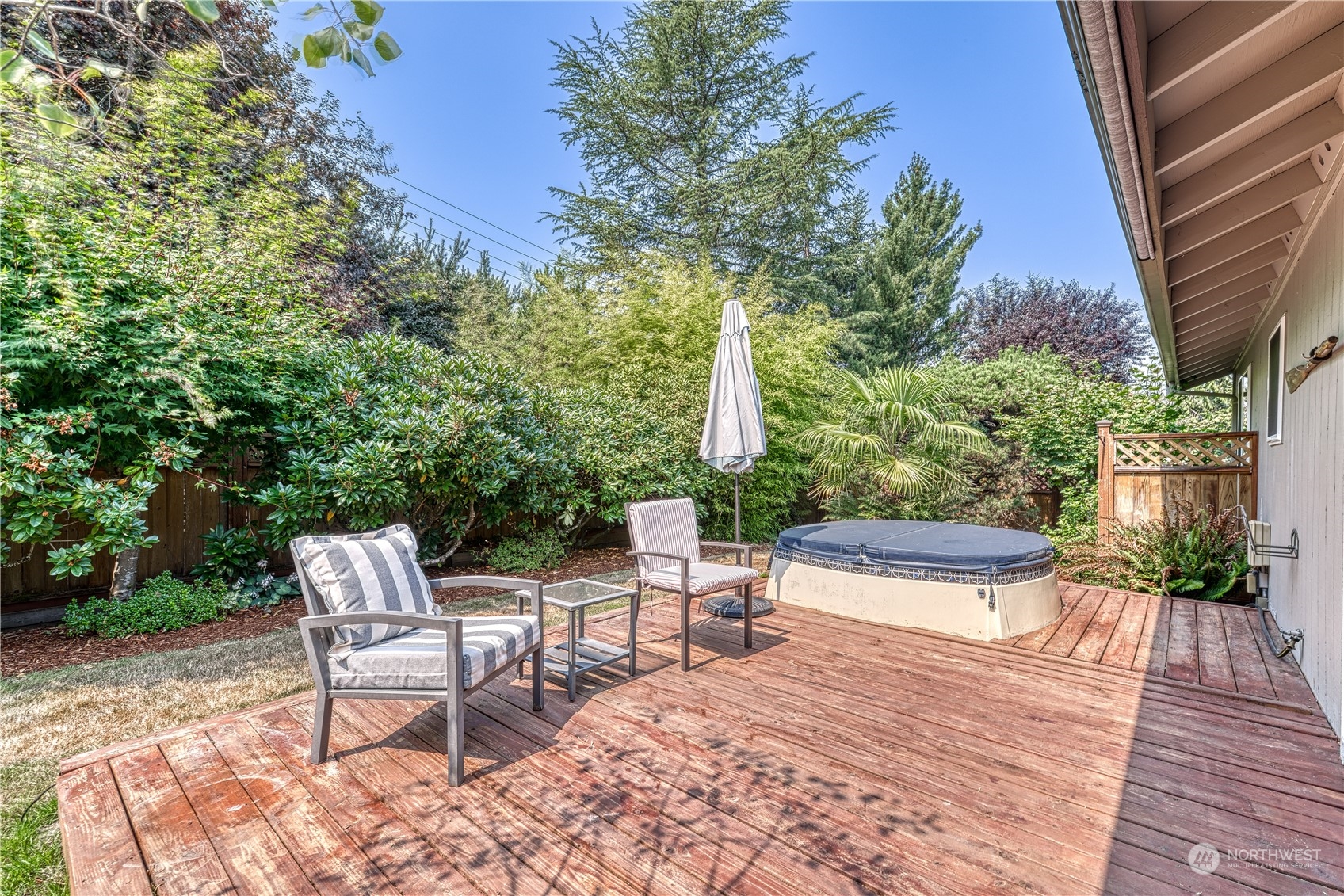 7720 Insel Avenue Gig Harbor, WA 98335 - Photo 24 of 29 a view of patio with a table and chairs and potted plants