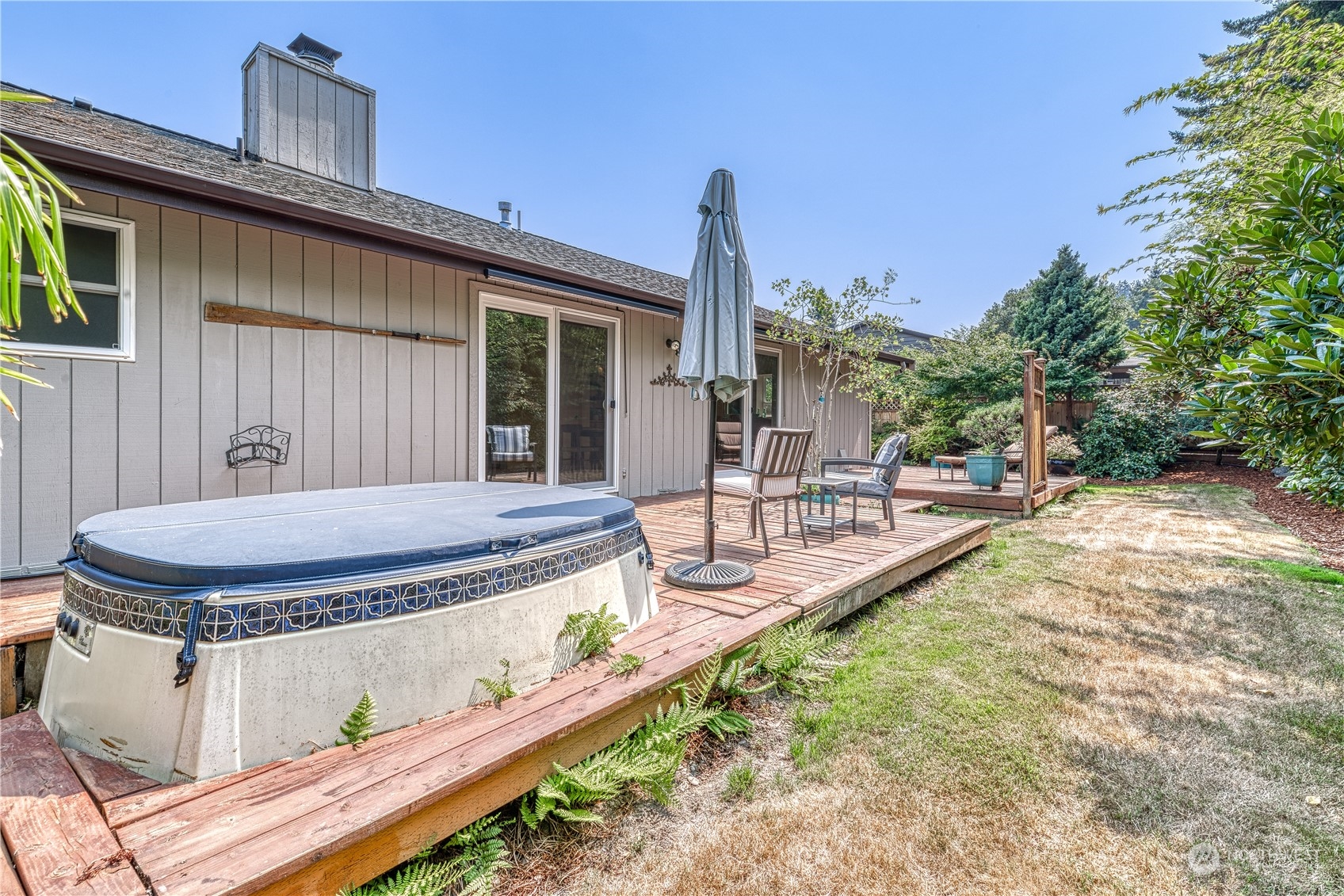 7720 Insel Avenue Gig Harbor, WA 98335 - Photo 27 of 29 a view of a house with backyard and sitting area