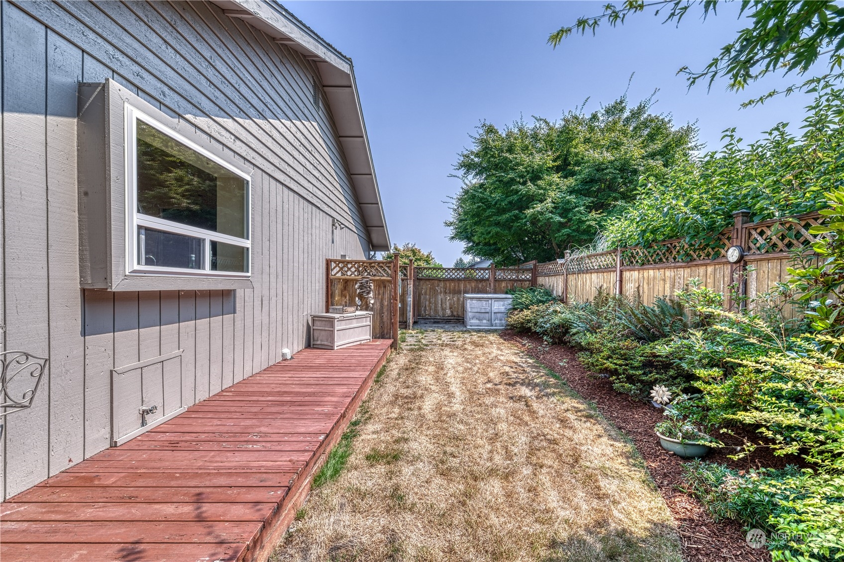 7720 Insel Avenue Gig Harbor, WA 98335 - Photo 28 of 29 a view of a house with backyard and sitting area