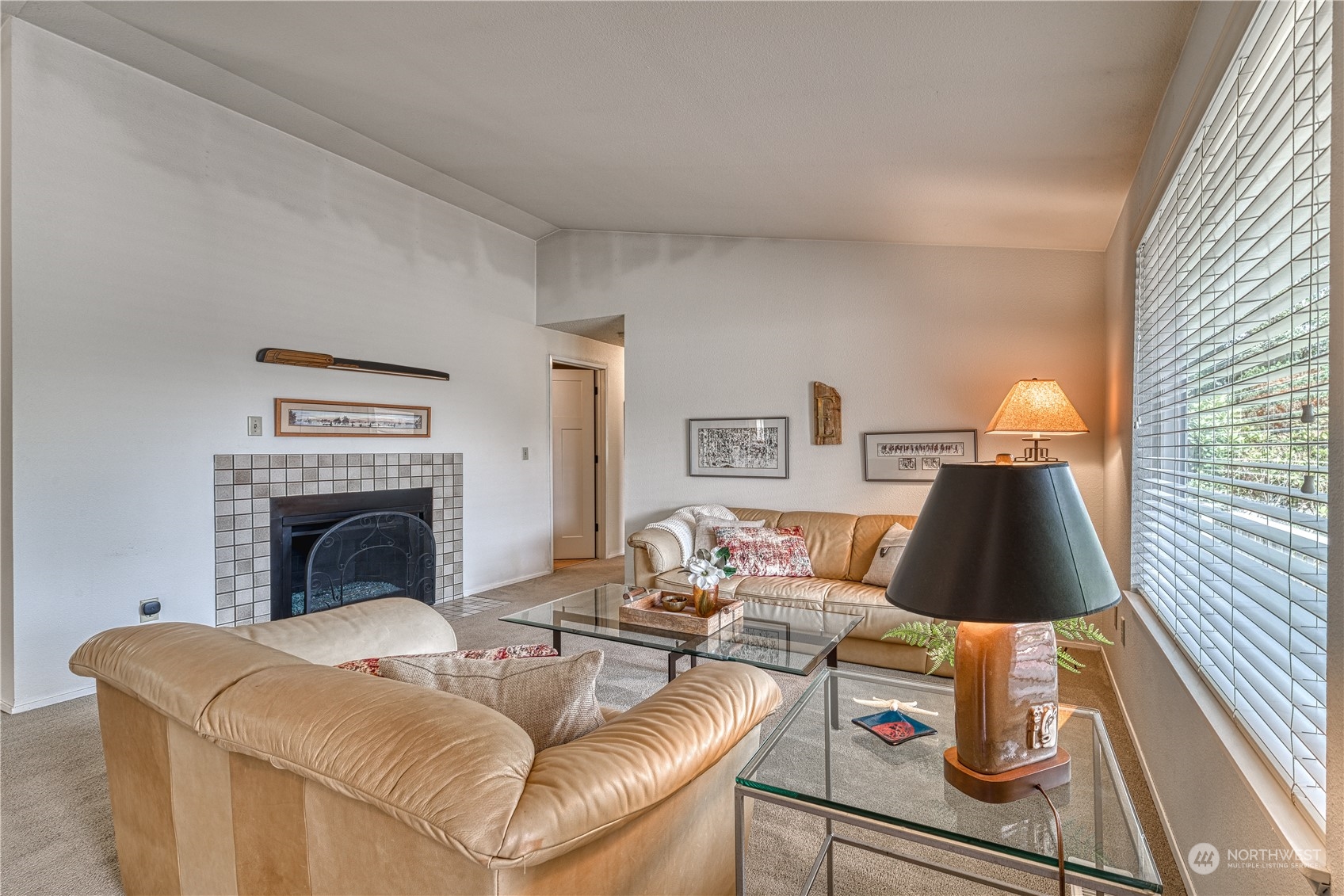 7720 Insel Avenue Gig Harbor, WA 98335 - Photo 5 of 29 a living room with furniture and a fireplace