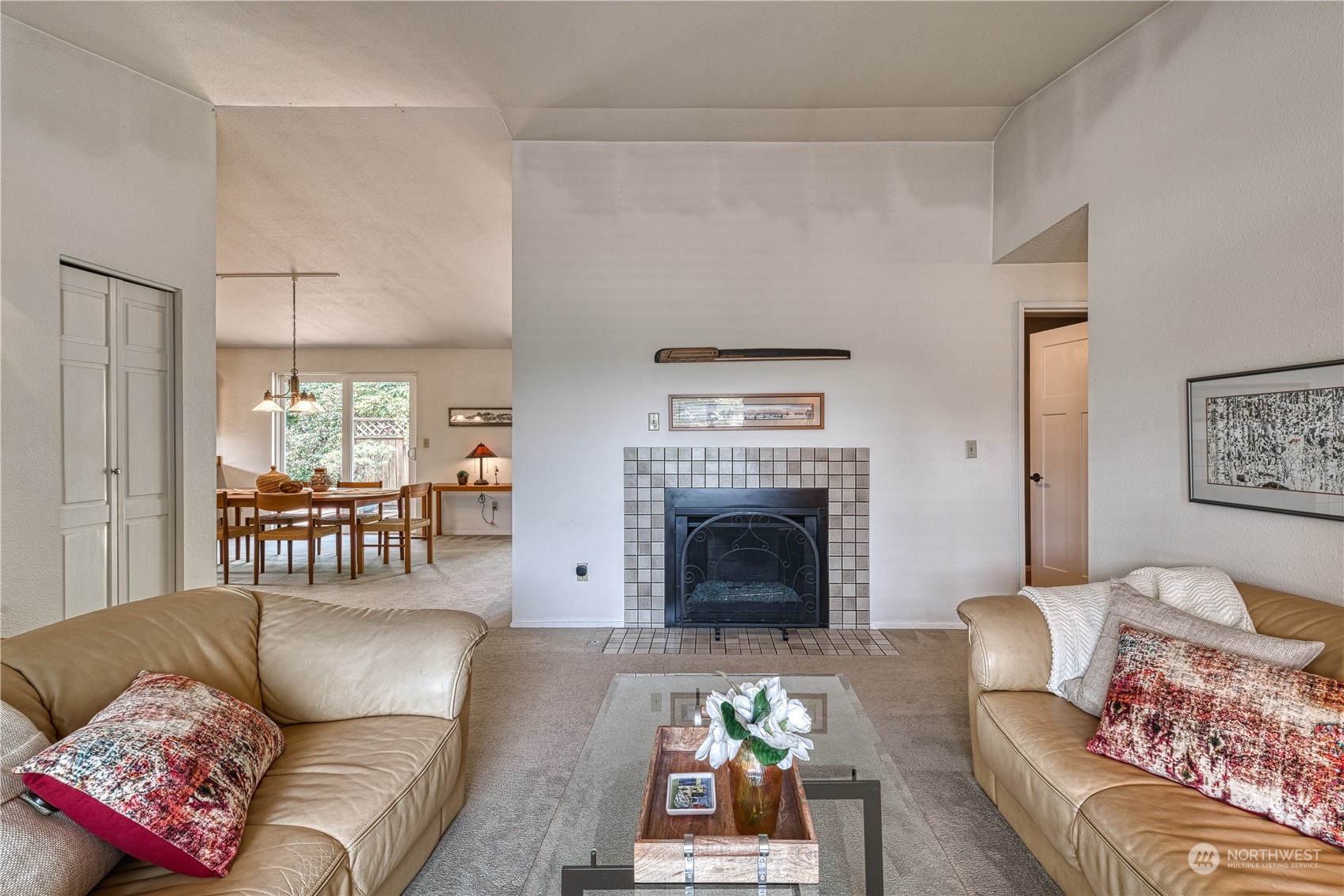 7720 Insel Avenue Gig Harbor, WA 98335 - Photo 6 of 29 a living room with furniture and a fireplace