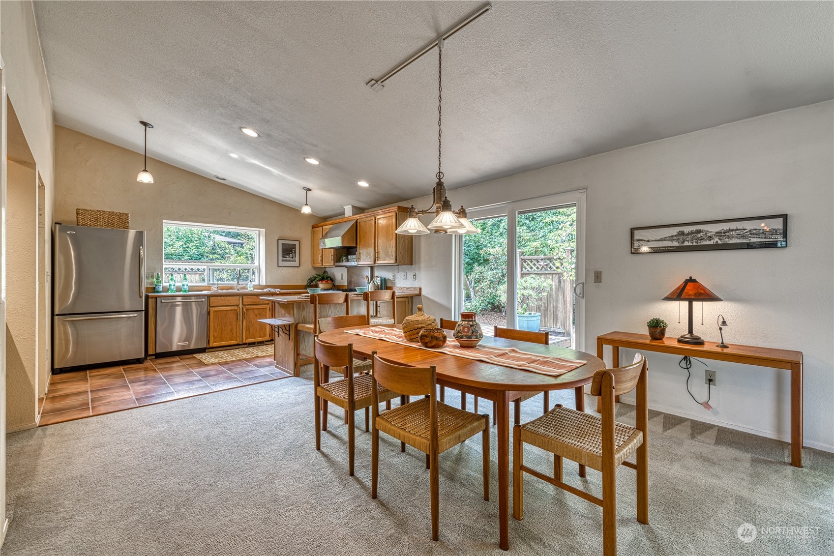 7720 Insel Avenue Gig Harbor, WA 98335 - Photo 7 of 29 a dining room with furniture and window