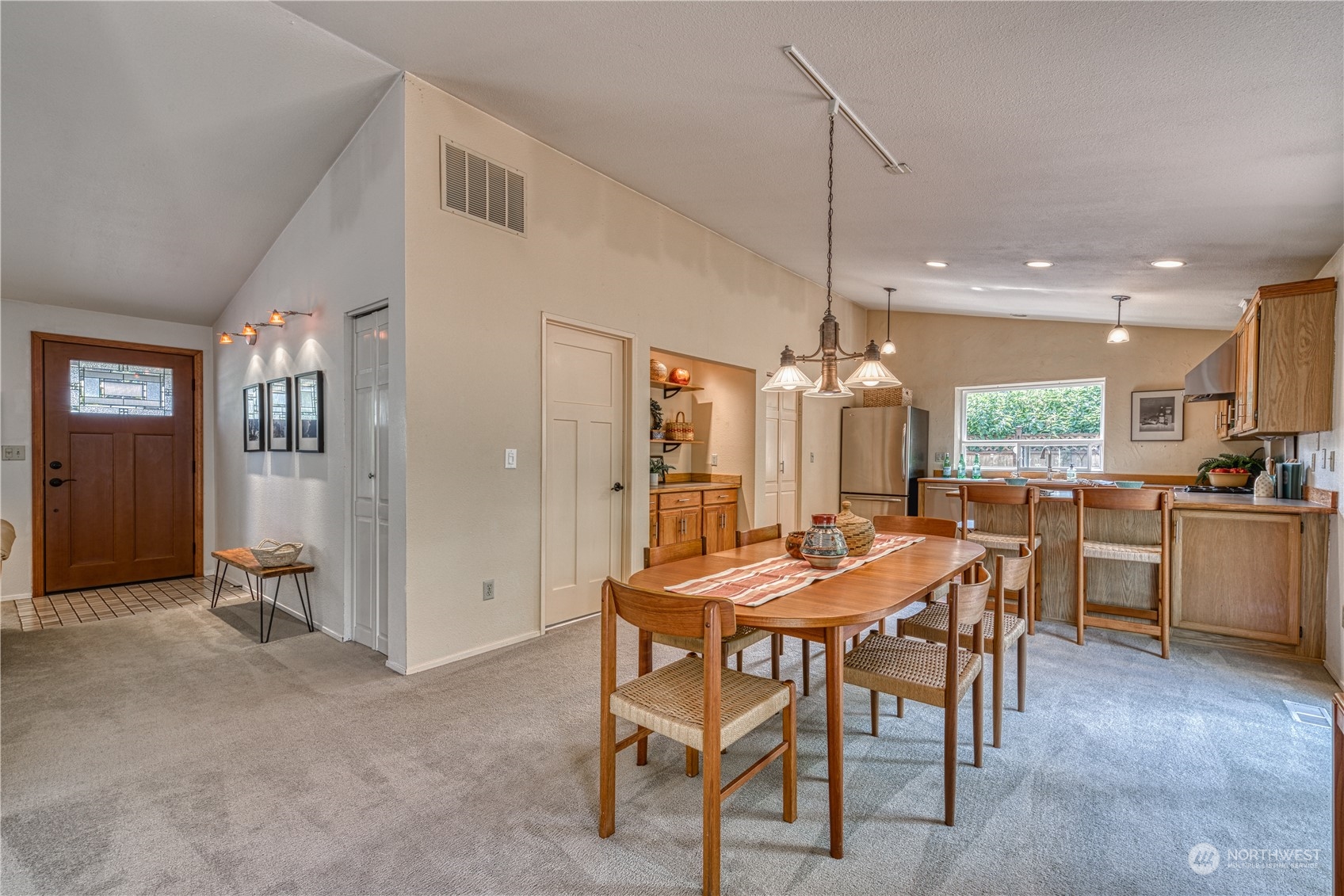 7720 Insel Avenue Gig Harbor, WA 98335 - Photo 8 of 29 a dining room with furniture and window