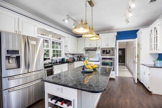 219 Broken Rock Road Hamilton, GA 31811 - Photo 13 of 44 a kitchen with stainless steel appliances granite countertop a refrigerator a oven and a sink