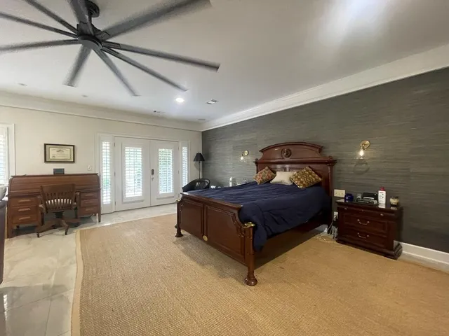 a bedroom with a bed and furniture