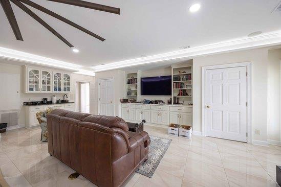 219 Broken Rock Road Hamilton, GA 31811 - Photo 18 of 44 a living room with furniture and a flat screen tv
