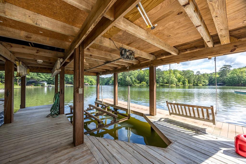 219 Broken Rock Road Hamilton, GA 31811 - Photo 31 of 44 a view of a wooden deck with a table and chairs next to a yard