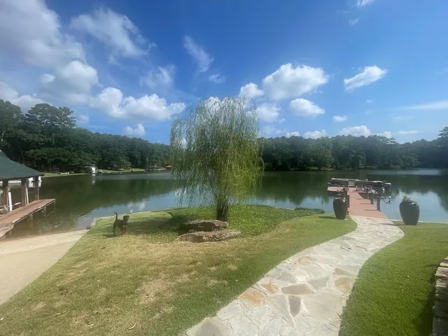 a view of a lake with a yard