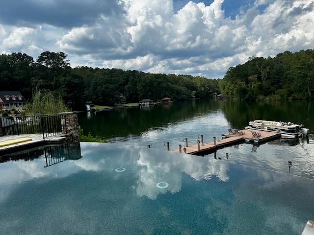 219 Broken Rock Road Hamilton, GA 31811 - Photo 40 of 44 a view of a lake with cars parked