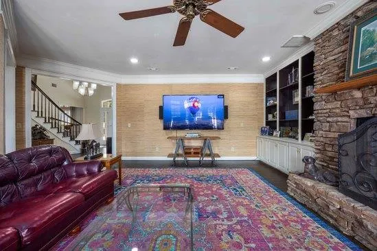 a living room with furniture and a rug