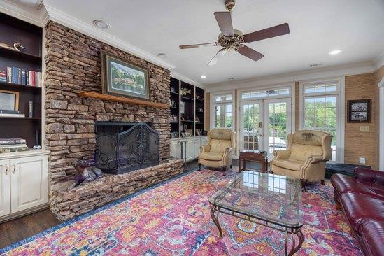 219 Broken Rock Road Hamilton, GA 31811 - Photo 6 of 44 a living room with furniture a flat screen tv and a fireplace
