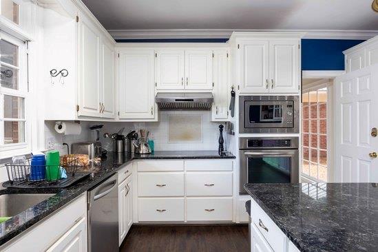 219 Broken Rock Road Hamilton, GA 31811 - Photo 7 of 44 a kitchen with granite countertop a sink a stove and cabinets