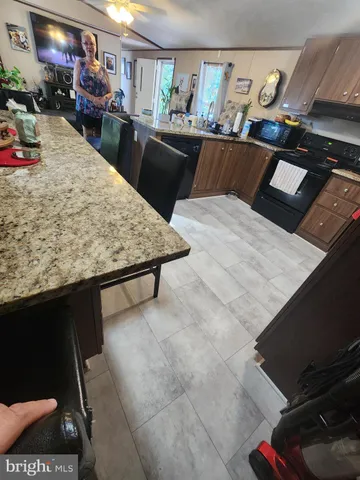 a living room with hard wood flooring