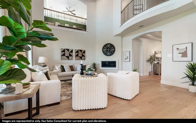 a living room with furniture and a clock