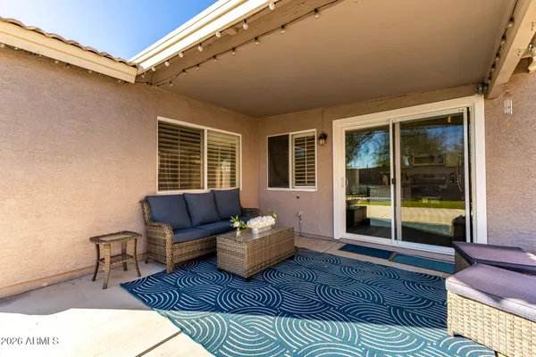 a outdoor space with patio the couches and a dining table with garden view
