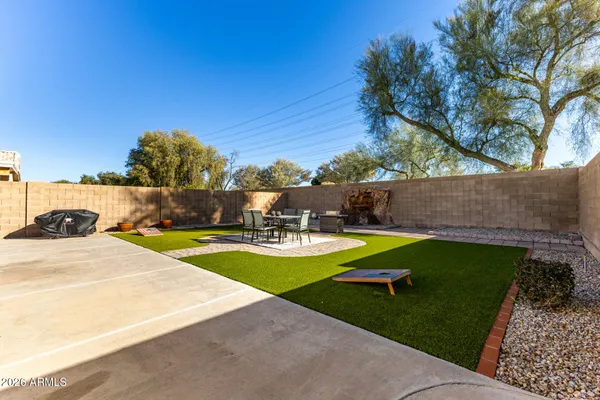 a view of a house with swimming pool and yard