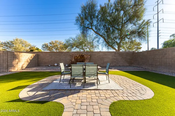 a view of a backyard with swimming pool