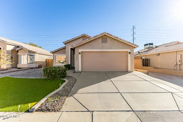 a front view of a house with a garage