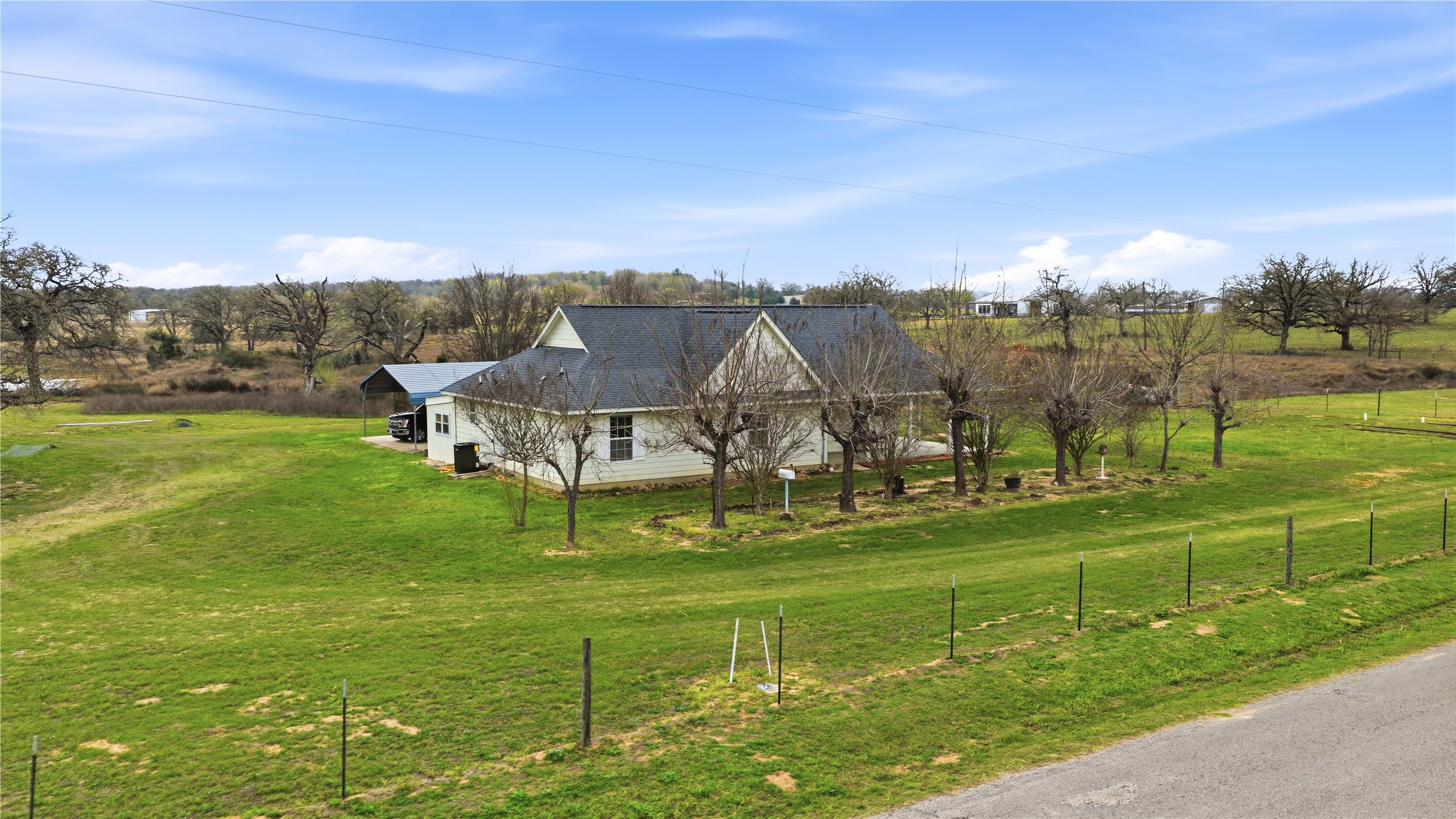 369 Young School House Road Smithville, TX 78957 - Photo 22 of 30 View of side of home with a view of countryside