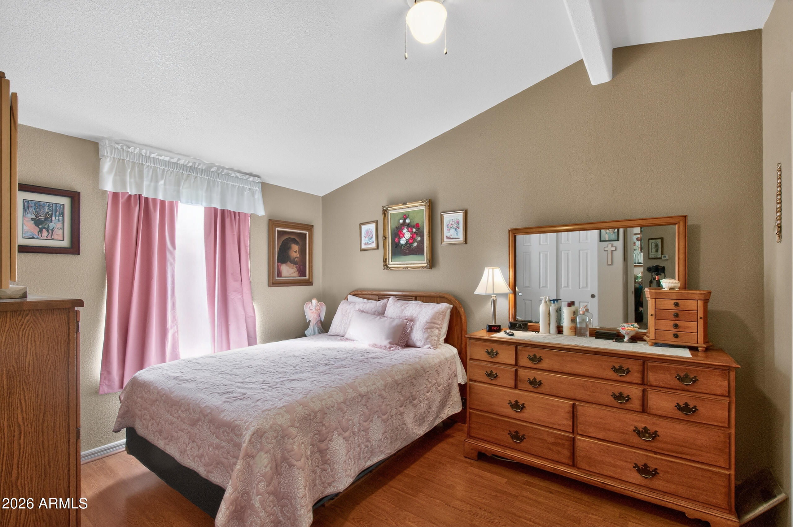 5735 East McDowell Road, Unit 408 Mesa, AZ 85215 - Photo 13 of 42 a bedroom with a bed and a dresser in it